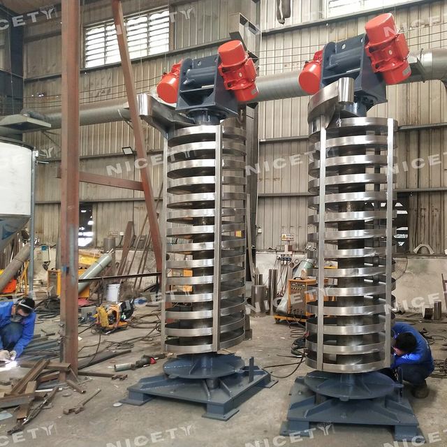 Vibrating spiral elevator